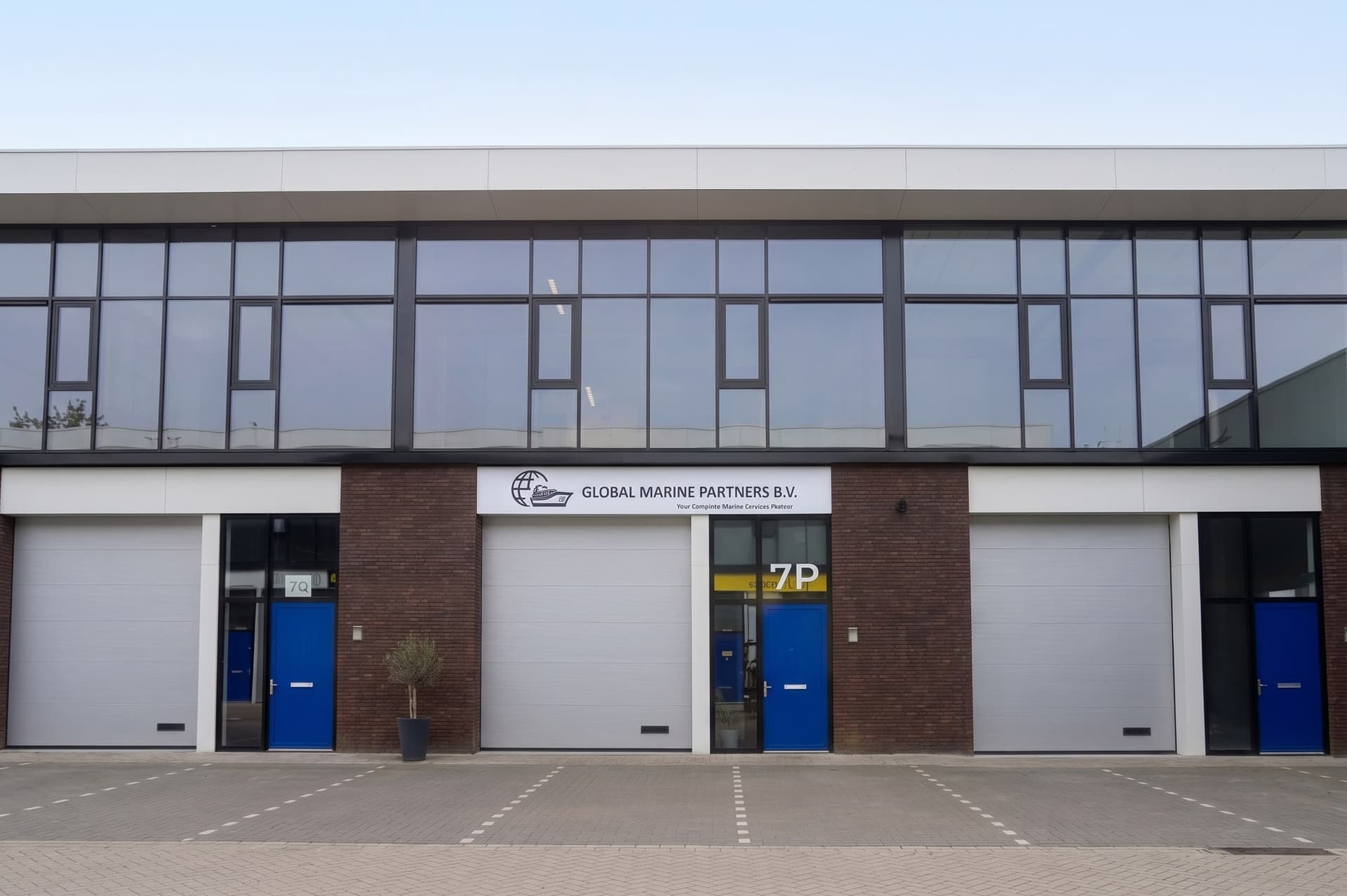 Front of the Global Marine Partners B.V. office in Rotterdam: brick façade, company sign above unit 7P and blue entrance doors
